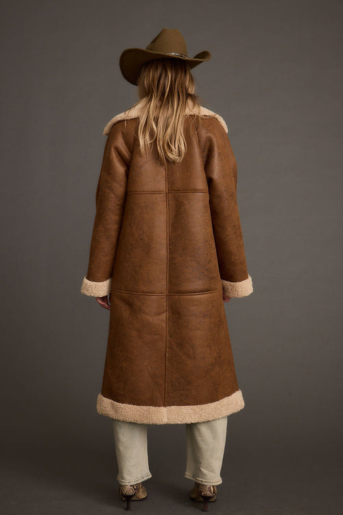 Back view of the brown jacket showing the silhouette and fit.