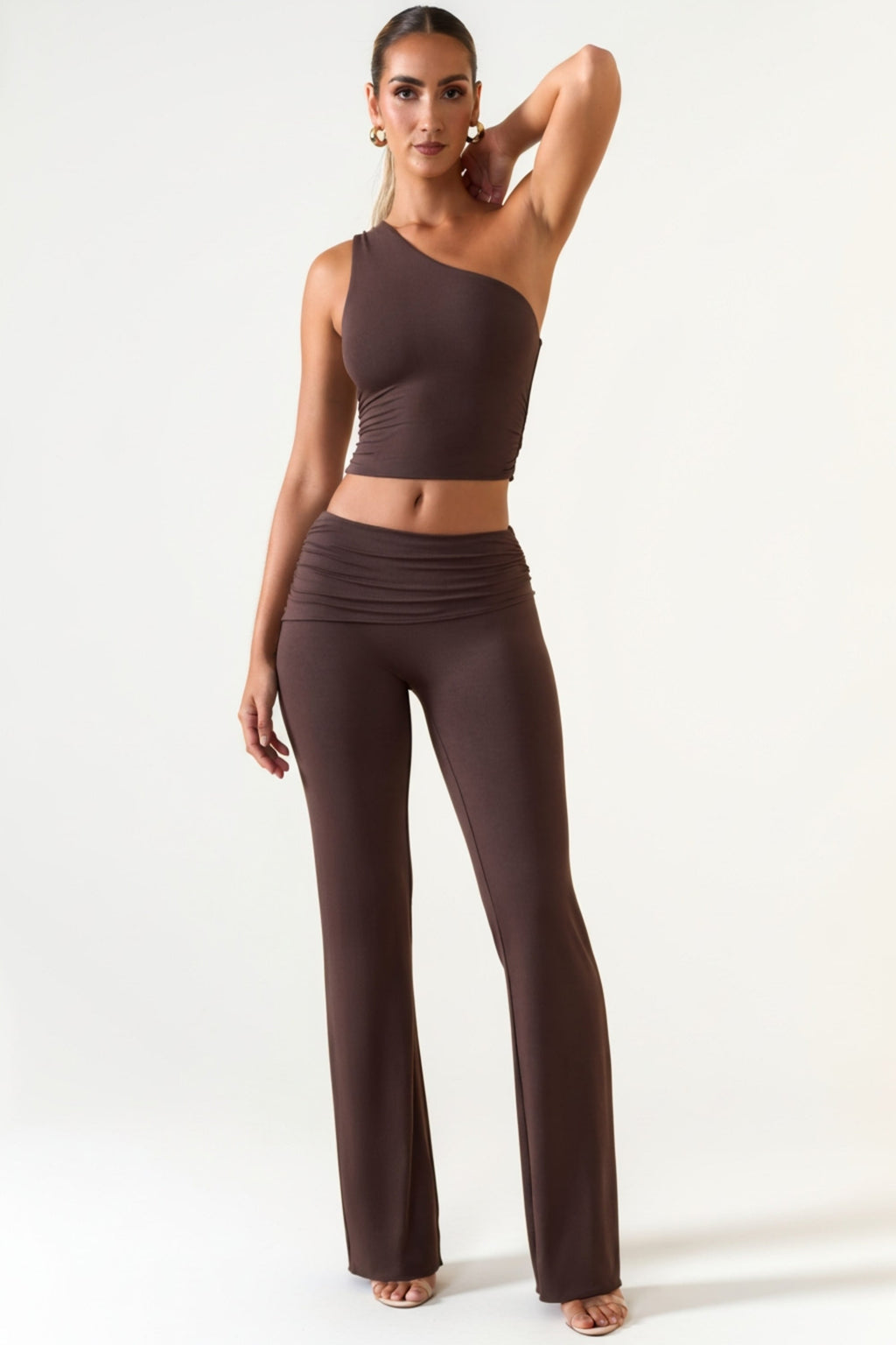 Oh Polly's Priscilla wearing the Hollis Trousers in Chocolate Brown Modal fabric perfect for a chic dinner date